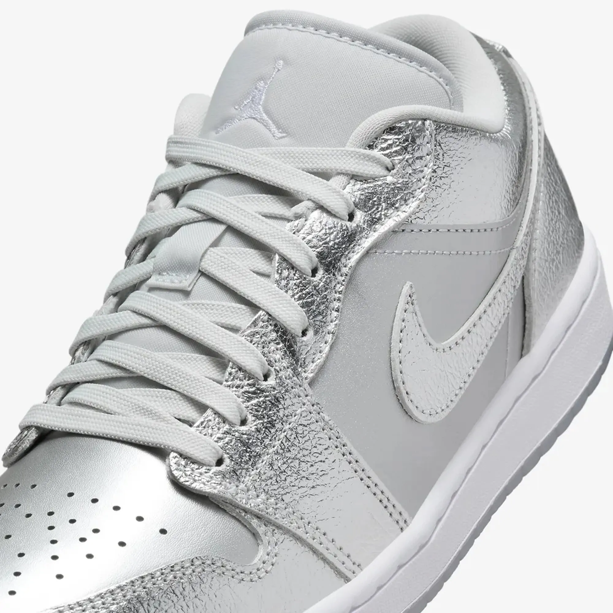 Jordan | WMN'S AIR JORDAN 1 LOW SE  { METALLIC SILVER/PHOTON DUST-WOLF GREY